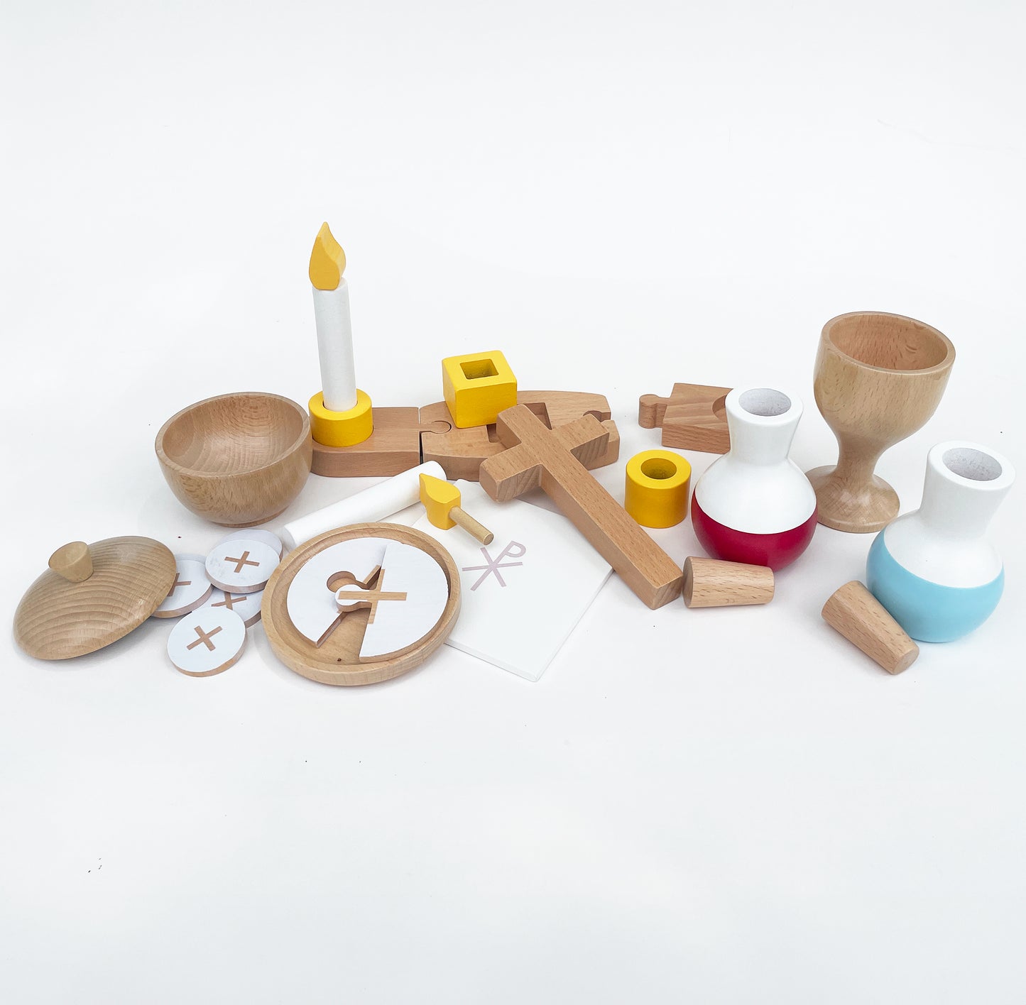 Selection of different wooden catholic toys for a catholic mass set.
