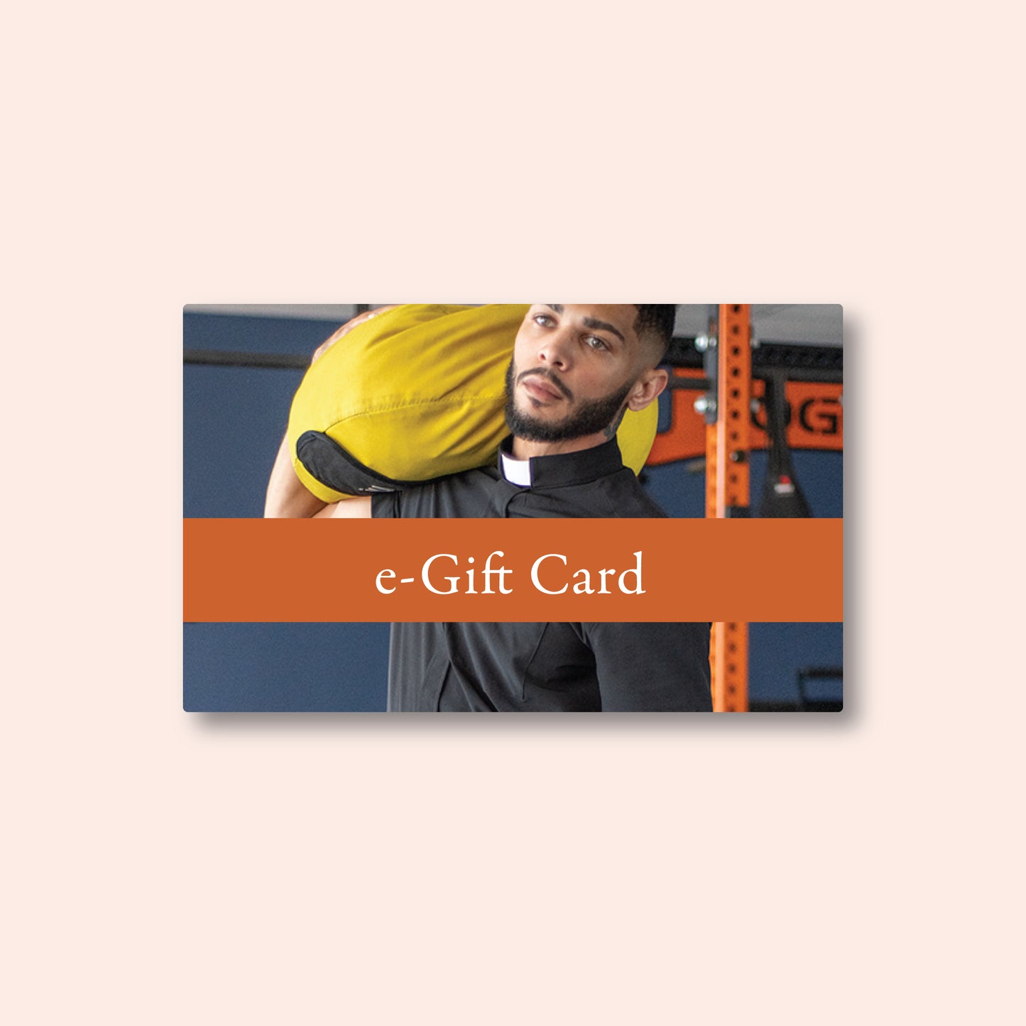 An e-gift card with an image of a person wearing a wicking vicar performance clergy shirt and carrying a weight bag in the gym, with an orange banner that reads 'e-Gift Card'.